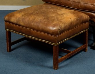 A vintage brown leather ottoman 305a67