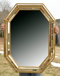 A vintage gilt wood wall mirror