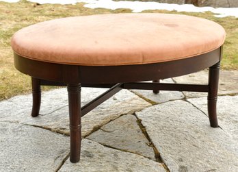 A contemporary oval leather ottoman  305bfd