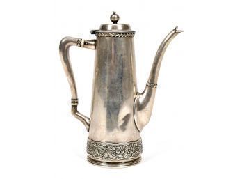 An antique sterling silver tea pot,