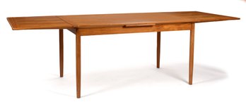 A vintage teak draw leaf dining