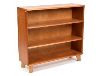 A vintage cherry bookshelf, with