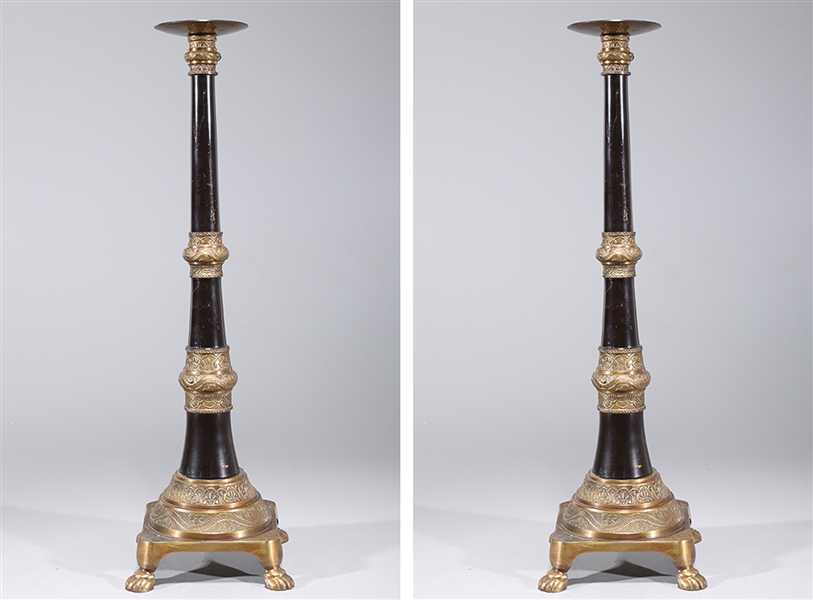 Pair of tall gilt metal candlesticks