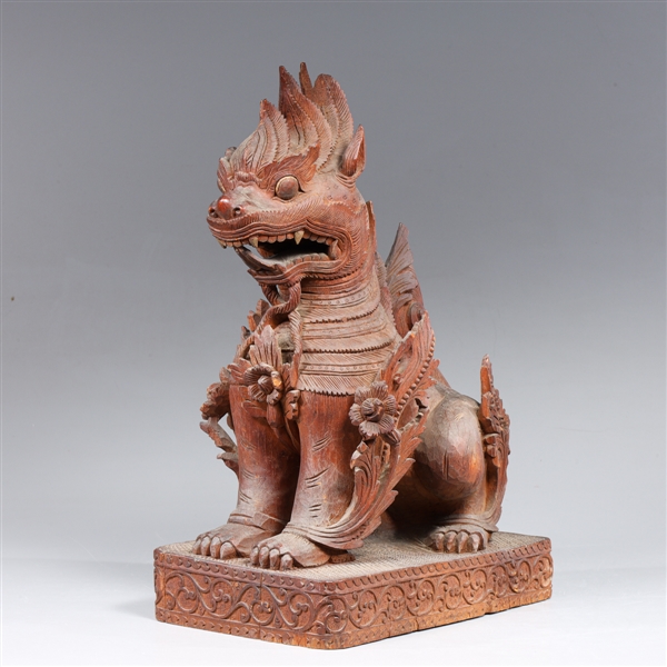 Carved wood southeast Asian seated