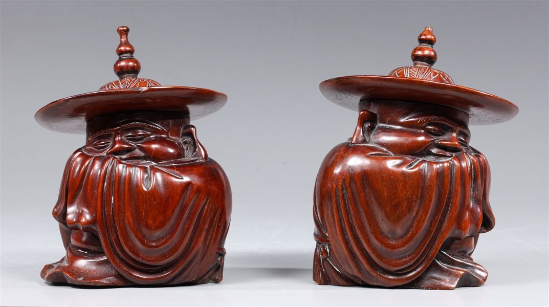 Pair of Chinese carved seated hat wearing