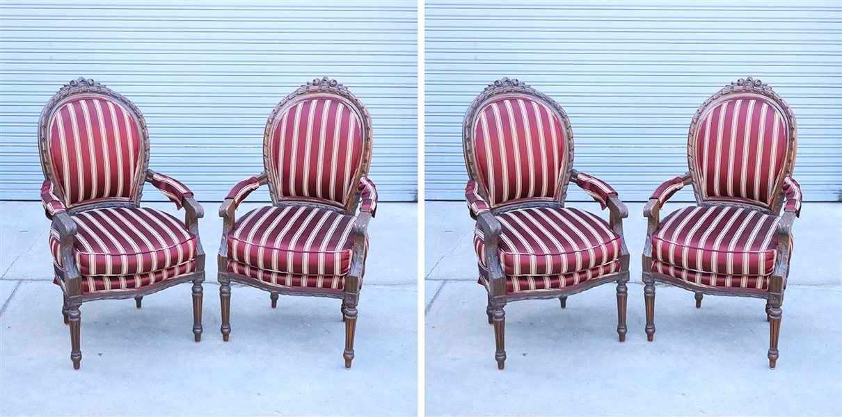 Pair of carved wood upholstered