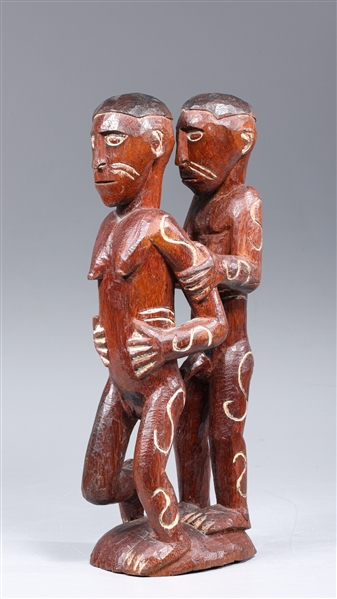 Hand carved erotic African figures in