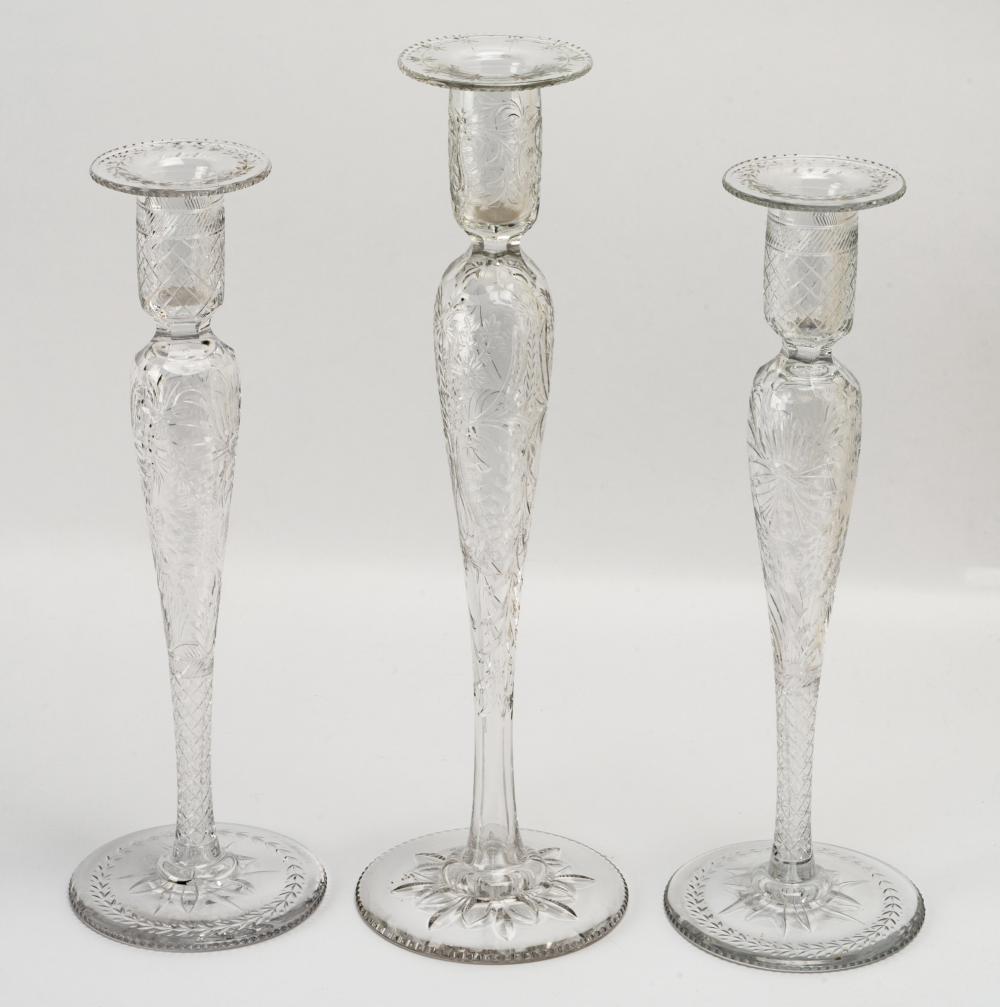 THREE ETCHED GLASS CANDLESTICKSThree 3046c8