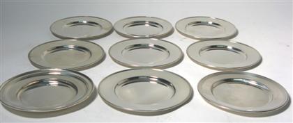 Nine sterling silver bread plates