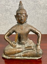 A vintage seated bronze buddha