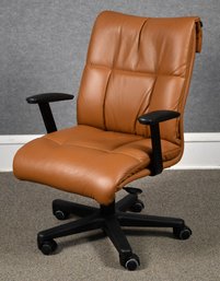 A brown leather swiveling, rolling,