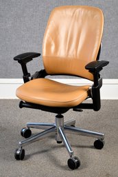 A fine quality brown leather swiveling,