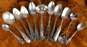 11 assorted sterling souvenir spoons,