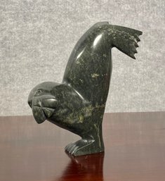 An Inuit black soapstone sculpture