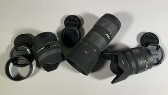 Three Sigma zoom lenses, including