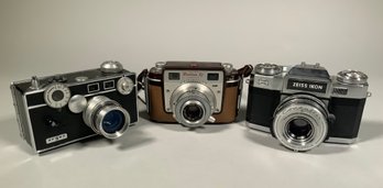 Three vintage 35mm film cameras