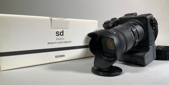 A Sigma SD Quattro with two battery