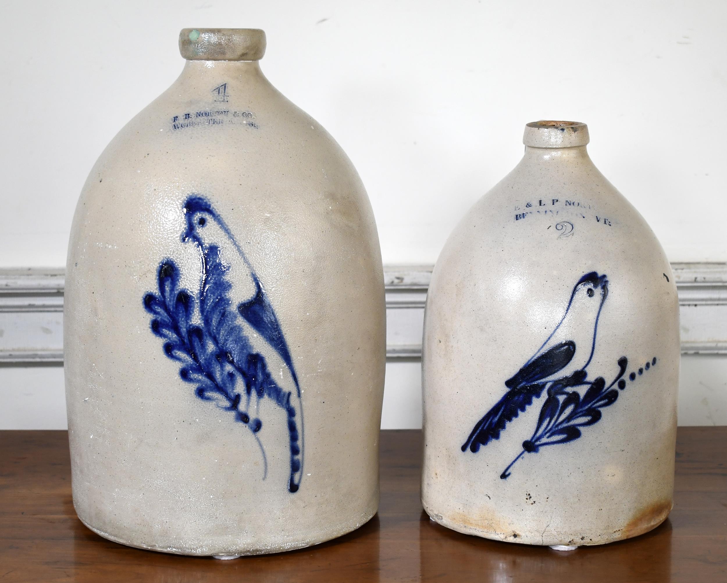 TWO NORTON STONEWARE JUGS W/BIRD DECORATION.