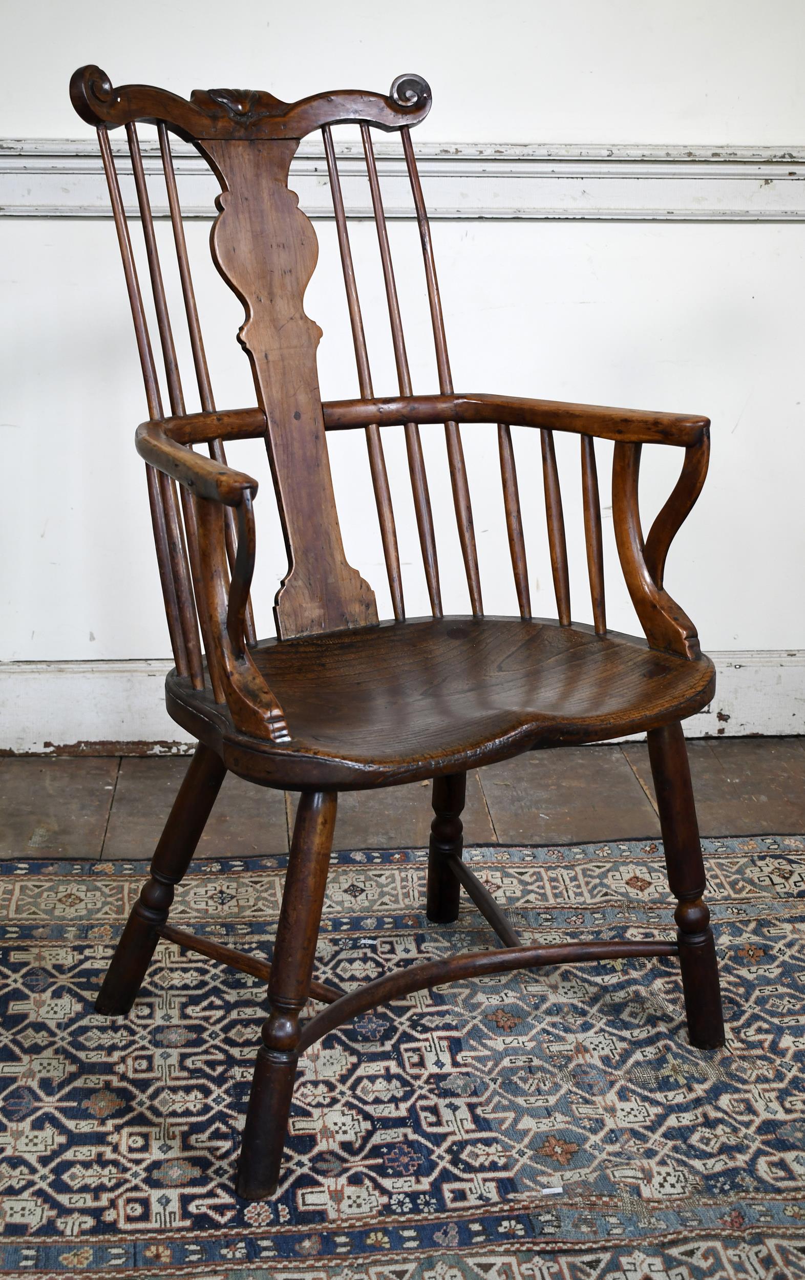 RARE 18TH C. CARVED WINDSOR ARMCHAIR.