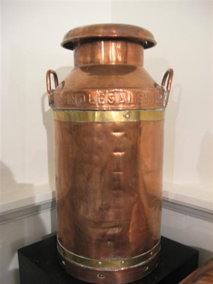 Large brass bound copper milk jug