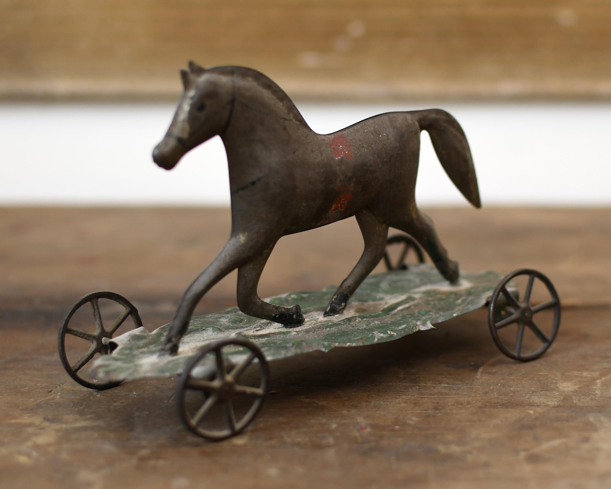 19TH C. PAINTED TIN HORSE TOY.