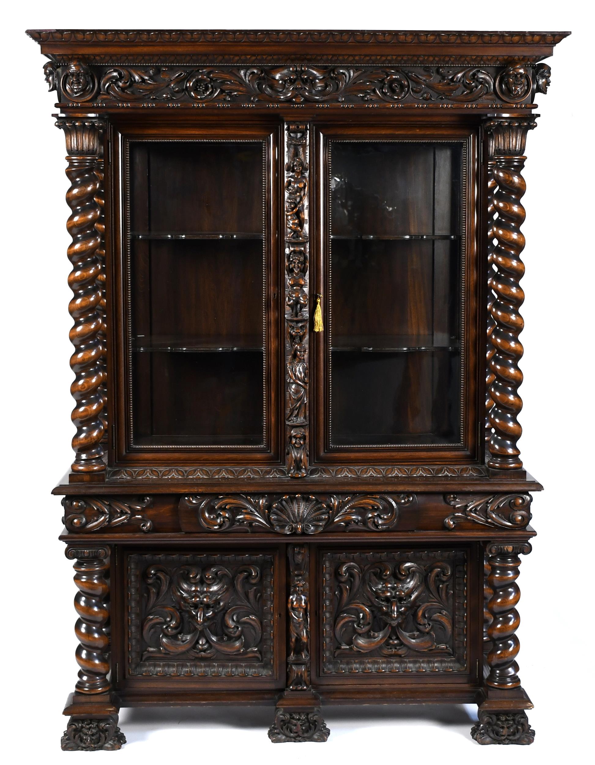 ANTIQUE HEAVILY CARVED EUROPEAN CABINET.