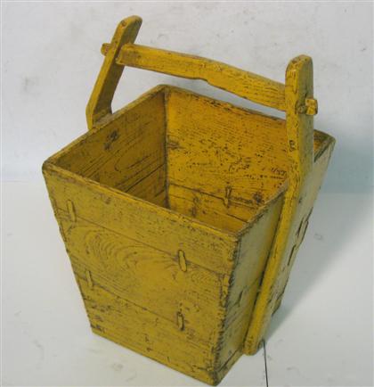 Yellow painted wooden bucket  