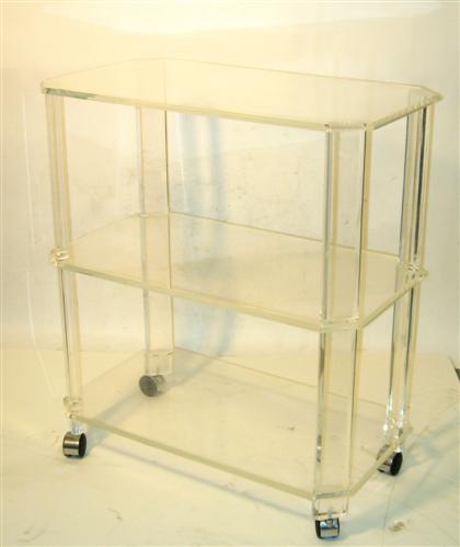 A lucite tea trolley    With 3