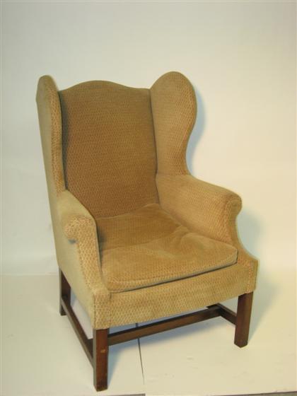 Beige upholstered wingback armchair 4d90a