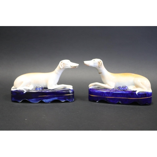 Pair of Staffordshire pottery recumbent