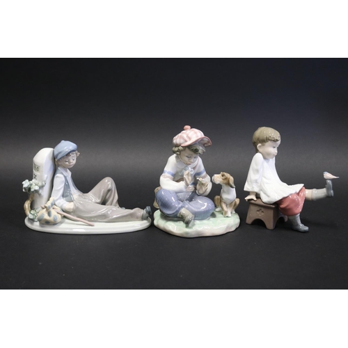 Three Lladro figures of boys, approx