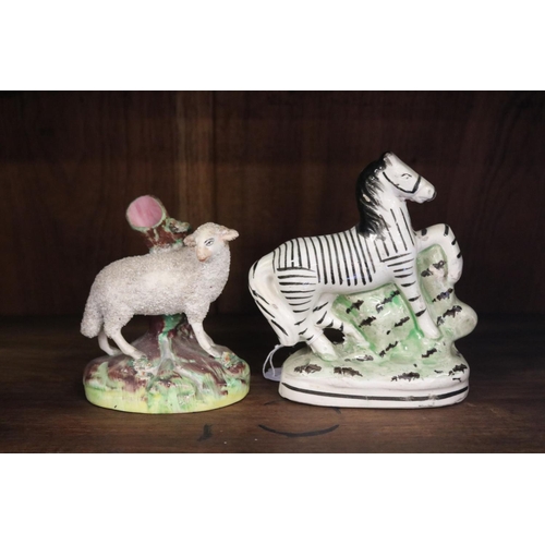 Two antique Staffordshire figures, Zebra