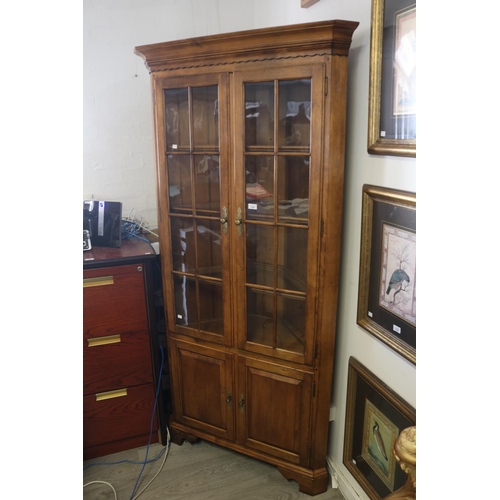 Corner cabinet, two glazed doors to