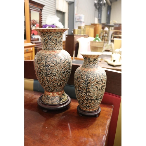 Two Chinese vases with wooden bases,