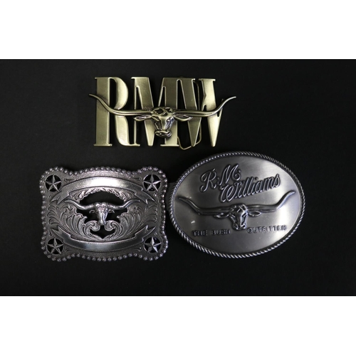 Two R M Williams belt buckles along 3083cd