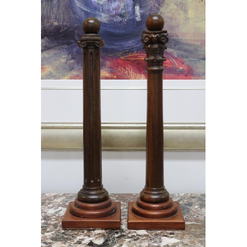 Two decorative carved wooden columns,