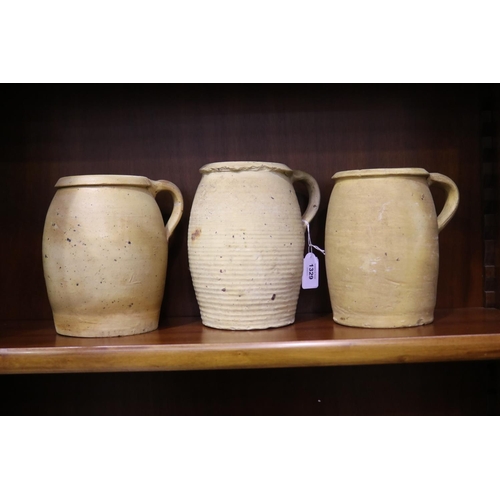 Three French stoneware jugs, has cracks,