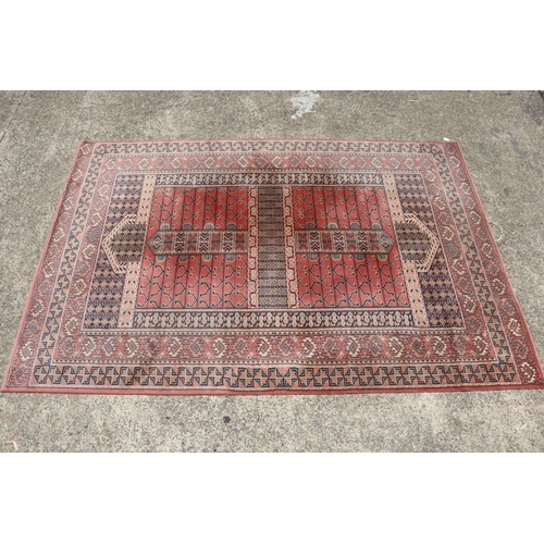 Handwoven red ground wool carpet  308505