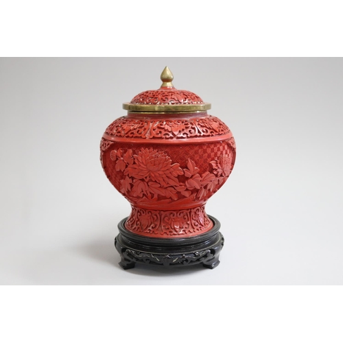 Chinese lidded cinnabar vase on 3085a7