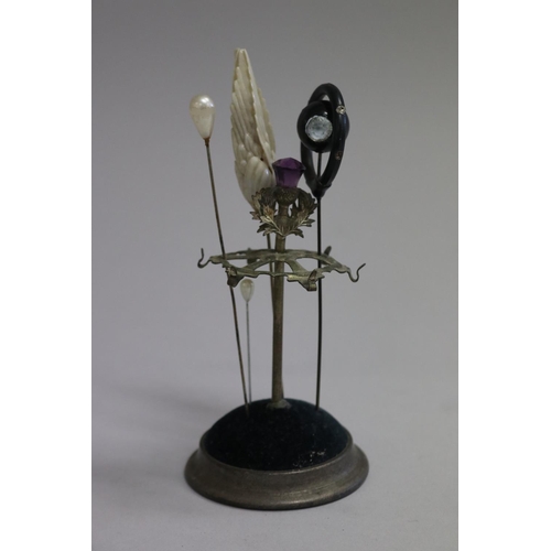 Antique hat pin stand with a Scottish