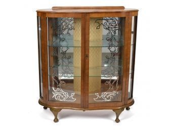 A 20th C. display cabinet in mahogany