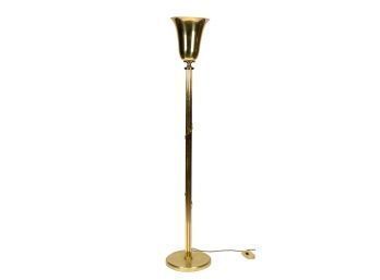 A modern brass floor lamp with 305fed