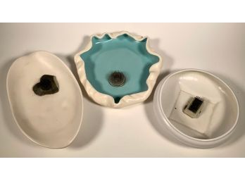 Three pieces of pottery, each with