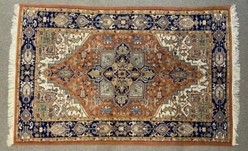 An oriental area rug, rust ground