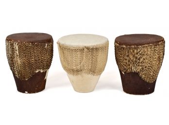 Three cowhide drums, with hide