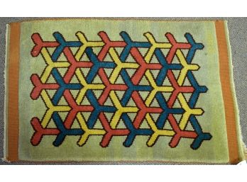 A small mid-century geometric rug,