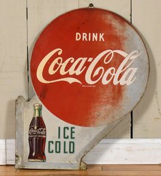 A vintage double-sided ‘Drink Coca-Cola