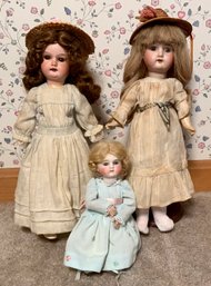 Three bisque head dolls, including: