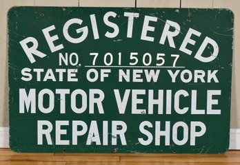 A vintage double-sided advertising sign,