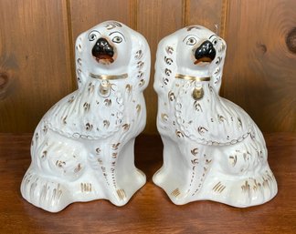 A pair of vintage Staffordshire dogs,